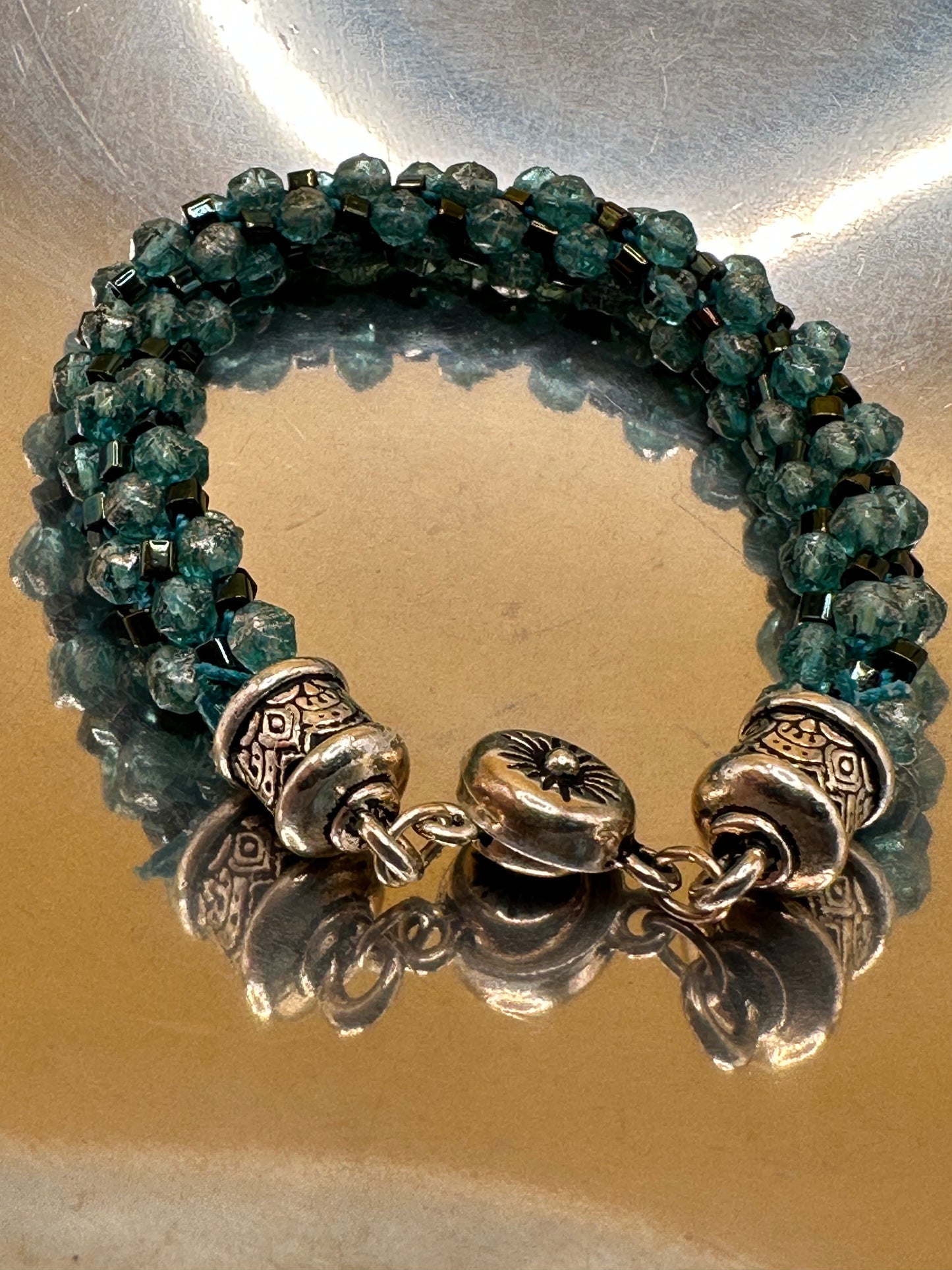 Kumihimo (Japanese braided)  Spiral Bracelet featuring green frosted bicone crystals