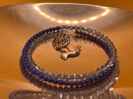 Blue double wrap memory wire bracelet with blue 4mm round blue beads and 4mm fire polished bicone beads featuring heart charm and pewter dove charm.