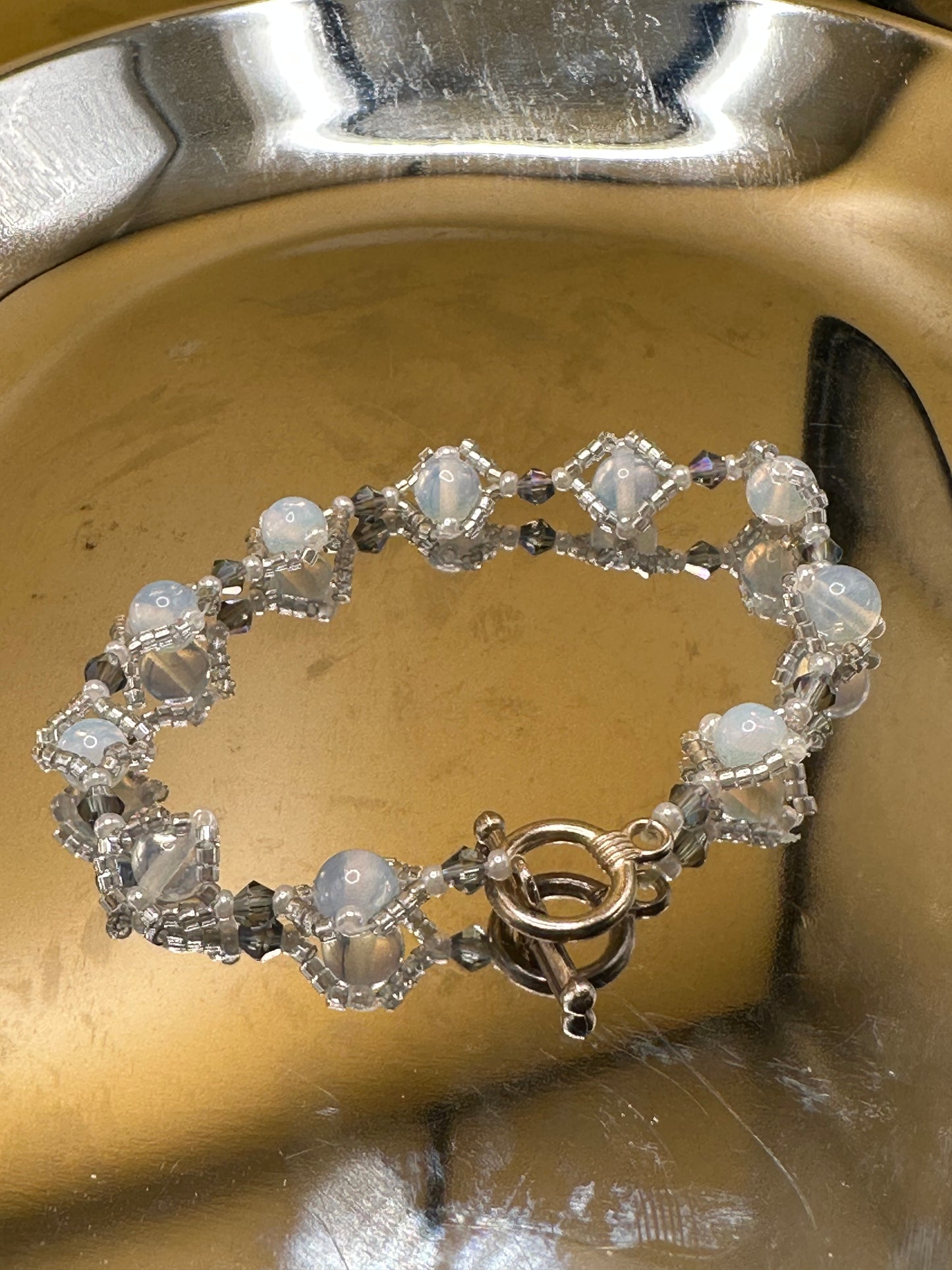 Natural Opal Semi precious Gemstone Bracelet with crystal bicone beads and translucent delica beads.