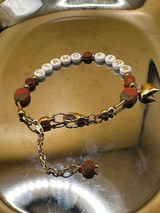 Unakite Jasper and sparkly goldstone round natural semi-precious stone. Gold tone magnetic clasp bracelet featuring white/gold bead "Stand Firm" with heart charm.