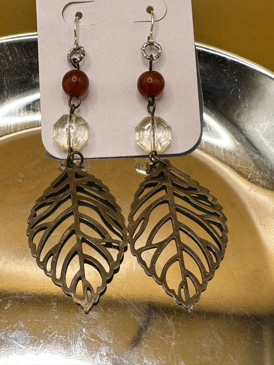 Bronze toned Large leaf earrings with burgundy and clear bead accents.